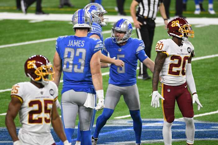 Prater celebrates with teammates after kicking game-winning field goal against Washington.